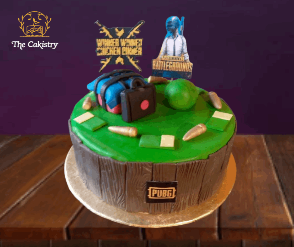 Cake decorated with PUBG-themed elements on a wooden table